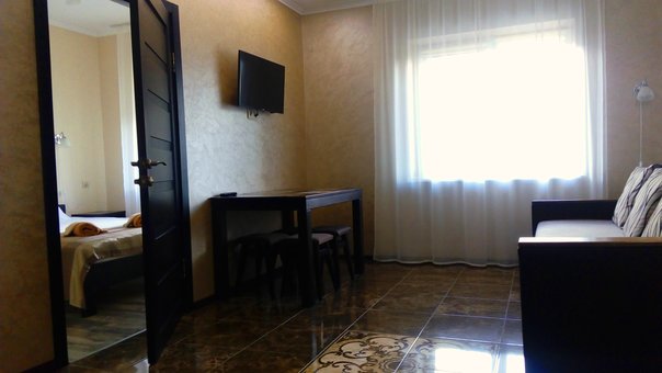 Living room of two-room apartments in the Polyana Aqua Resort hotel in Polyana. Book a room for a promotion.