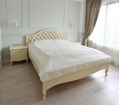 A bed made of natural wood in the Giga Style carpentry and furniture workshop. Order with a discount.