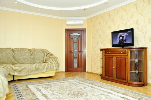 Вітальня VIP апартаментів «Велкам24» у Києві. Бронюйте по акції.