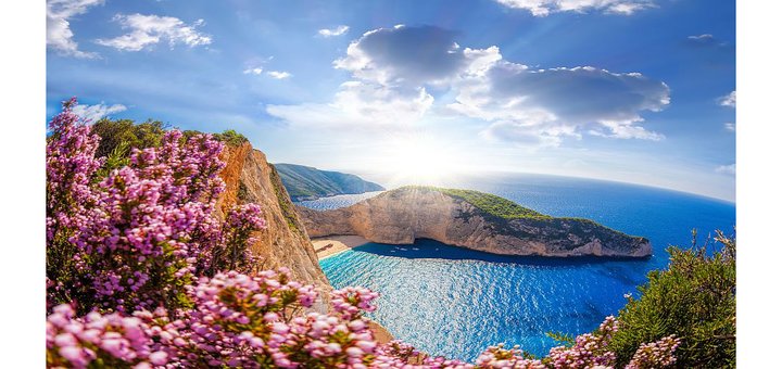 https://cdn1.pokupon.ua/uploaded/new_campaign_pictures/513536/data/main720x340/Navagio-beach-with-shipwreck-and-flowers-against-sunset-Zakynthos-island-Greece.jpg?1537443441