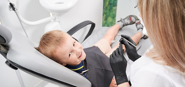 https://cdn1.pokupon.ua/uploaded/new_campaign_pictures/955699/data/main620x292/cheerful-little-boy-sitting-dental-chair-dental-office.jpg?1771319559