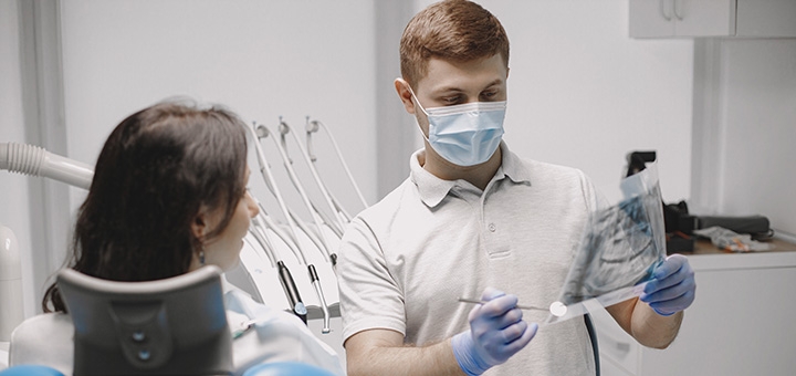 https://cdn1.pokupon.ua/uploaded/new_campaign_pictures/966701/data/main720x340/female-patient-looking-her-x-ray-stomatologist-shows-picture-oral-cavity.jpg?1790073150